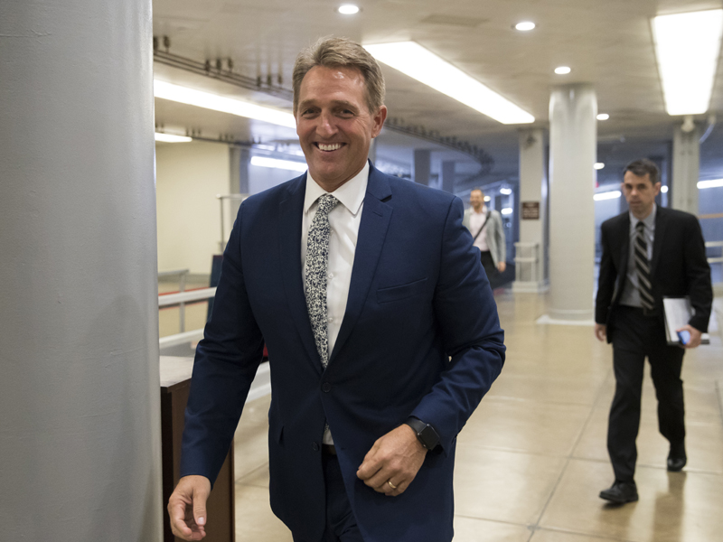 Sen. Jeff Flake, R-Ariz., a member of the Foreign Relations Committee, arrives for the start of a closed-door security briefing at the Capitol in Washington, Wednesday, Oct. 25, 2017. (AP Photo/J. Scott Applewhite)