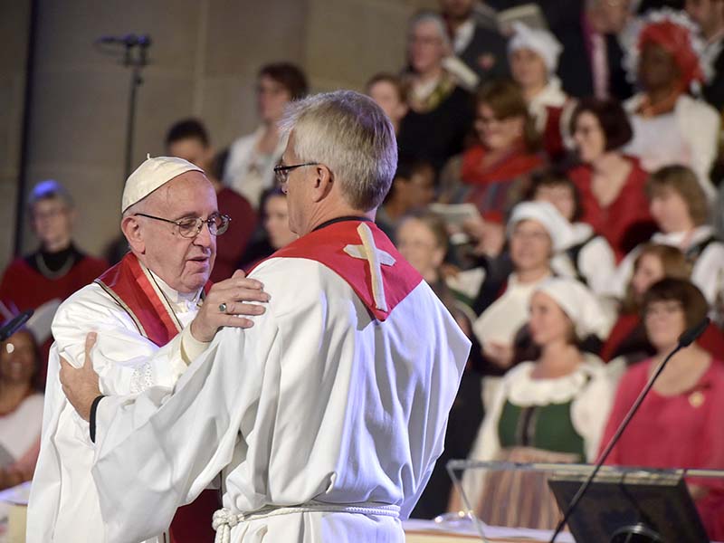 Pope Francis, left, embraces General Secretary of the Lutheran World Federation Rev. Martin Junge during an ecumenical mass in the cathedral in Lund, Sweden, on Oct. 31, 2016.  Photo courtesy of Osservatore Romano via Reuters
