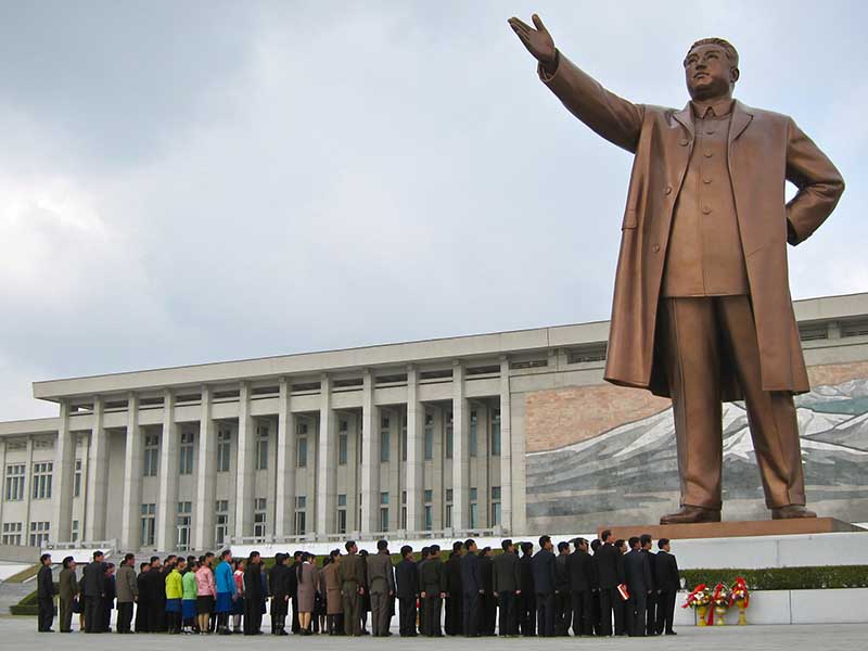 People gather at the Mansudae Grand Monument in Pyongyang, North Korea. Photo courtesy of John Pavelka, Creative Commons
