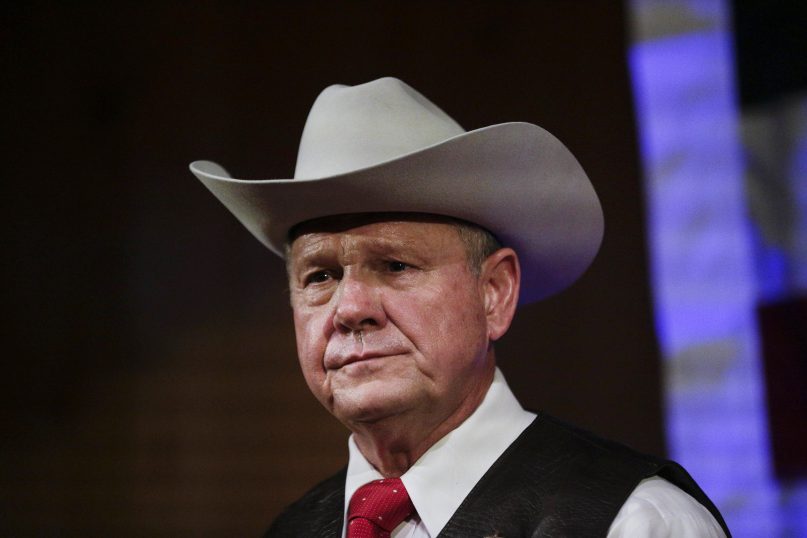 In this Monday, Sept. 25, 2017, file photo, former Alabama Chief Justice and U.S. Senate candidate Roy Moore speaks at a rally, in Fairhope, Ala. According to a Washington Post story Nov. 9, an Alabama woman said Moore made inappropriate advances and had sexual contact with her when she was 14. (AP Photo/Brynn Anderson, File)