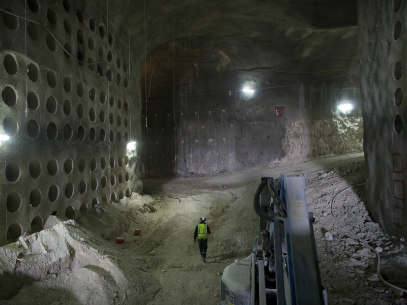 In this Nov. 14, 2017, photo, a worker walks at the construction site of a massive underground cemetery in Jerusalem. Tunnels running more than a kilometer under one of the holiest cities in the world have been carefully dug in the past two years to allow a unique burial site for some 22,000 graves. (AP Photo/Oded Balilty)