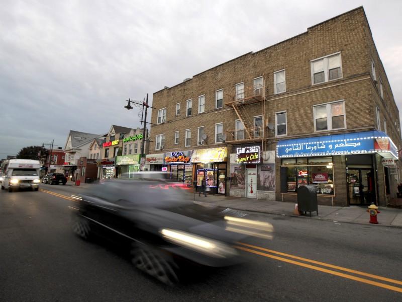 In a photo taken Wednesday, Nov. 1, 2017, Arabic writing is seen store signs along Main Street in Paterson, N.J. The North Jersey town, which is home to a large Muslim community, has drawn attention in the wake of an attack in Manhattan, where a Paterson resident drove a pick-up truck onto a bike path, killing several people and injuring others. (AP Photo/Julio Cortez)