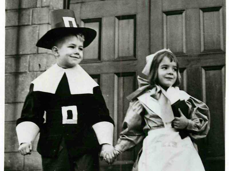 Frankie Fox and Sharon Palm wear Pilgrim costumes for their Thanksgiving celebrations in 1988. Their community center sponsored a pageant for the kids to help teach them about the first Thanksgiving. RNS file photo by Hugh Scott