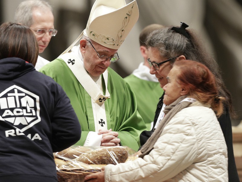 Pope Francis celebrates a Mass on Nov. 19, 2017, in St. Peter Basilica at the Vatican. Francis offered hundreds of poor people — homeless, migrants, unemployed — a lunch of gnocchi, veal and tiramisu on Sunday as he celebrated his first World Day of the Poor with a concrete gesture of charity in the spirit of his namesake, St. Francis of Assisi. (AP Photo/Andrew Medichini)