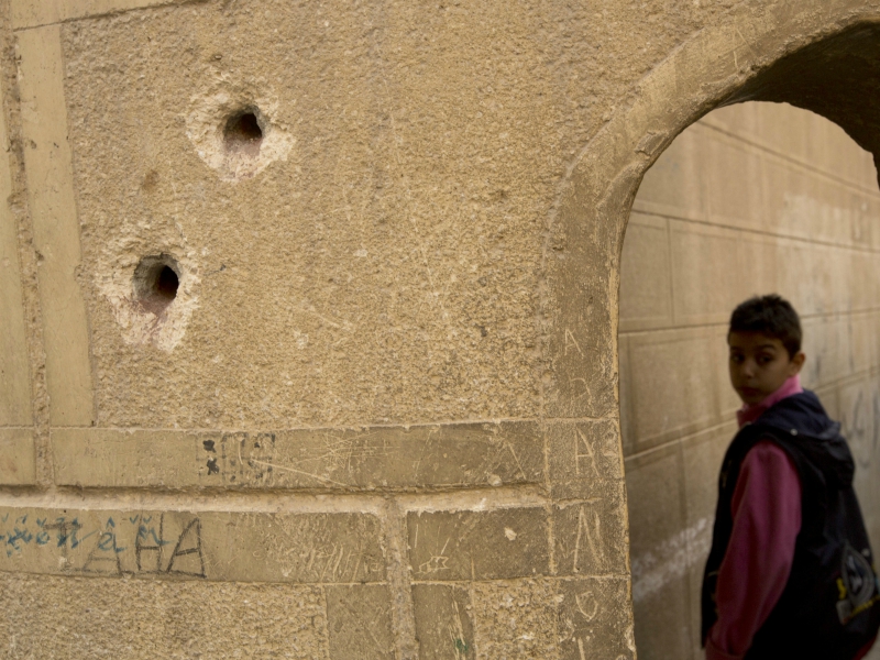Bullets holes are seen on the police booth outside Mar Mina church, in Helwan, Cairo, Egypt, Friday, Dec. 29, 2017, where at least 10 people, including eight Coptic Christians, have been killed in a shootout outside the church. (AP Photo/Amr Nabil)