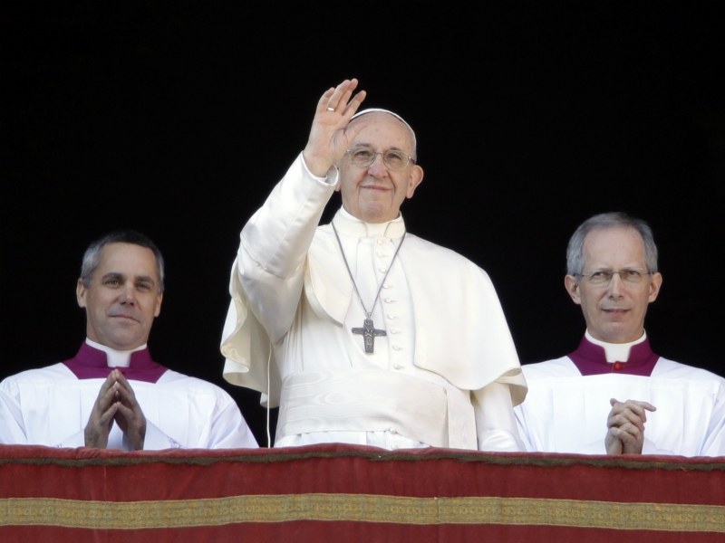 Pope Francis waves to the faithful during the Urbi et Orbi (Latin for 