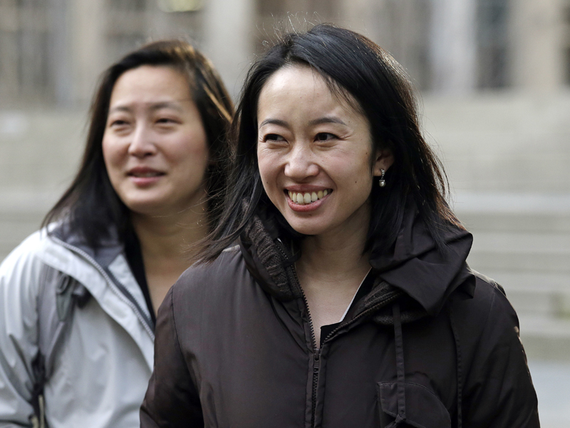 Mariko Hirose, right, a litigation director at the Urban Justice Center, and Esther Sung, a staff attorney at the National Immigration Law Center, smile as they leave a federal courthouse after speaking with media members there Thursday, Dec. 21, 2017, in Seattle. Lawyers representing refugees who have legally settled in the U.S. are asking a federal judge to stop the Trump administration from keeping refugee families from entering the country. 