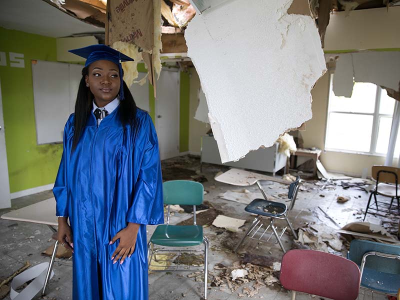 Standing in a destroyed classroom on Dec. 7, 2017, at St. Joseph High School, Taiesa Williams, age 17, plans to study nursing next year in college, hopefully at North Carolina State A&T University in Greensboro. RNS photo by Rich Kalonick/Catholic Extension