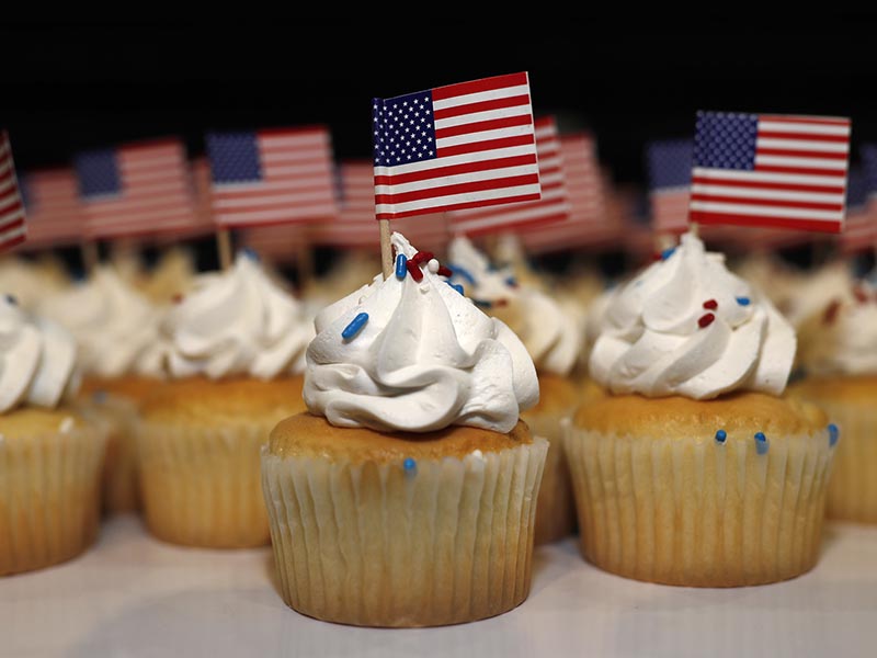 Cupcakes adorned with American flags sit on trays for supporters of Jack Phillips, owner of Masterpiece Cakeshop, after a rally on the campus of a Christian college on Nov. 8, 2017, in Lakewood, Colo. The small rally was held to build support for Phillips, who is at the center of a case that will be considered by the U.S. Supreme Court in December. The case may determine if business owners like Phillips are having their right of religious liberty and free expression violated by having to offer their wedding services to same-sex couples. (AP Photo/David Zalubowski)