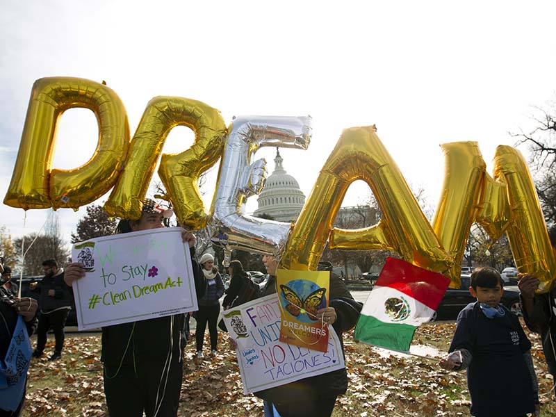 Demonstrators hold up balloons during an immigration rally in support of the Deferred Action for Childhood Arrivals (DACA), and Temporary Protected Status (TPS), programs, near the U.S. Capitol in Washington, Wednesday, Dec. 6, 2017. ( AP Photo/Jose Luis Magana)