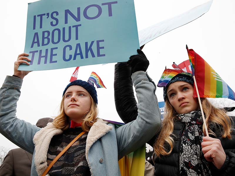 Lydia Macy, 17, left, and Mira Gottlieb, 16, both of Berkeley, Calif., rally outside of the Supreme Court on the day of the hearing for the Masterpiece Cakeshop v. Colorado Civil Rights Commission case, Tuesday, Dec. 5, 2017, in Washington. (AP Photo/Jacquelyn Martin; caption amended by RNS)