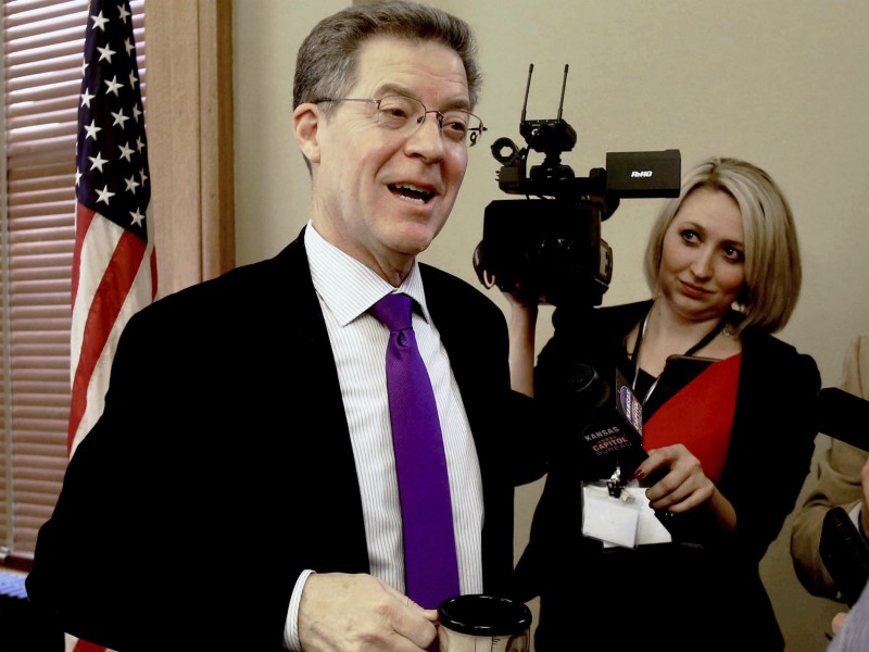 Gov. Sam Brownback reacted Wednesday afternoon, Jan. 24, 2018, to the news that his nomination to become ambassador-at-large for international religious freedom advanced Wednesday on a tied procedural vote broken by Vice President Mike Pence. Brownback had just finished presiding over the State Finance Council, which voted to approve a $362 million rebuild of Lansing Correctional Facility. (AP Photo, Topeka Capital-Journal, Thad Allton)