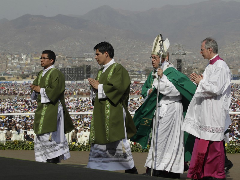 Pope Francis arrives on the altar to celebrate Mass at Las Palmas Air Base in Lima, Peru, on Jan. 21, 2018. (AP Photo/Alessandra Tarantino)