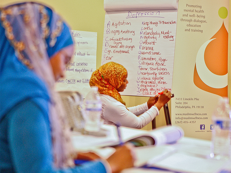 Women participate in a mental health first aid training program for imams and community members sponsored by the Muslim Wellness Foundation in Atlanta in 2014. Photo by Rahmeek Rasul