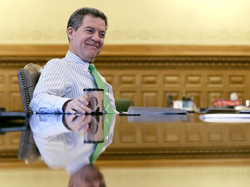 Kansas Gov. Sam Brownback talks about his term as governor during an interview at the Kansas Statehouse in Topeka, Kan, on Dec. 20, 2017. Brownback is the new ambassador-at-large for international religious freedom. (AP Photo/Charlie Riedel)