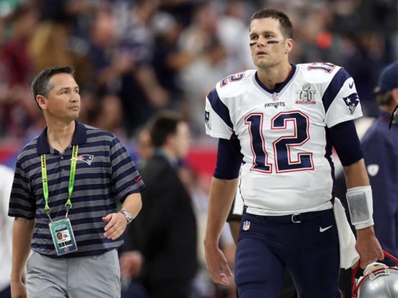 New England Patriots quarterback Tom Brady, right, with his trainer Alex Guerrero on the sideline before the Super Bowl game  against the Atlanta Falcons on February 5, 2017, in Houston, Texas, site of Super Bowl LI.  (Damian Strohmeyer via AP)