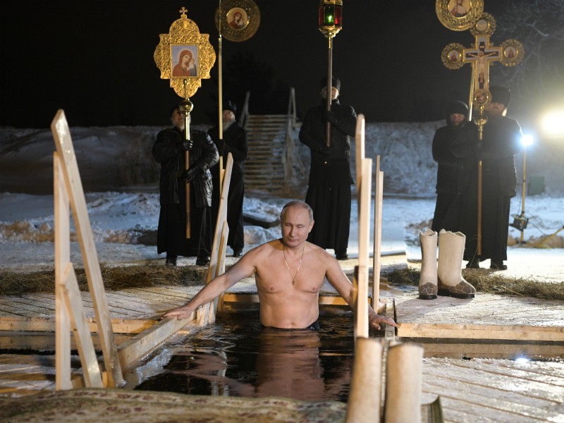 Russian President Vladimir Putin bathes in ice-cold water on Epiphany near St. Nilus Stolobensky Monastery on Lake Seliger in Svetlitsa village, Russia, on Jan. 19, 2018. Thousands of Russian Orthodox Church followers will plunge into icy rivers and ponds across the country to mark Epiphany, cleansing themselves with water deemed holy for the day. (Alexei Druzhinin, Sputnik,  Kremlin Pool Photo via AP; caption amended by RNS)