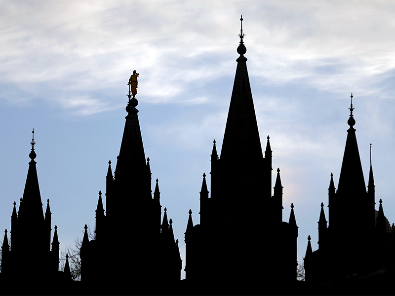 The angel Moroni statue, silhouetted against the sky, sits atop the Salt Lake Temple, at Temple Square, on Jan. 3, 2018, in Salt Lake City. (AP Photo/Rick Bowmer)