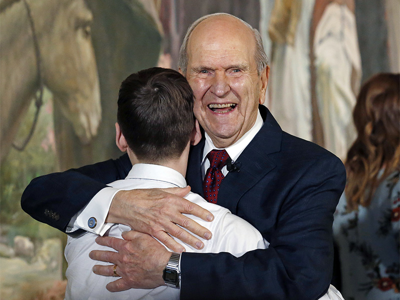 President Russell M. Nelson hugs a family member after a news conference Jan. 16, 2018, in Salt Lake City announcing his new leadership in the wake of the death of President Thomas S. Monson. (AP Photo/Rick Bowmer) (Caption amended by RNS)