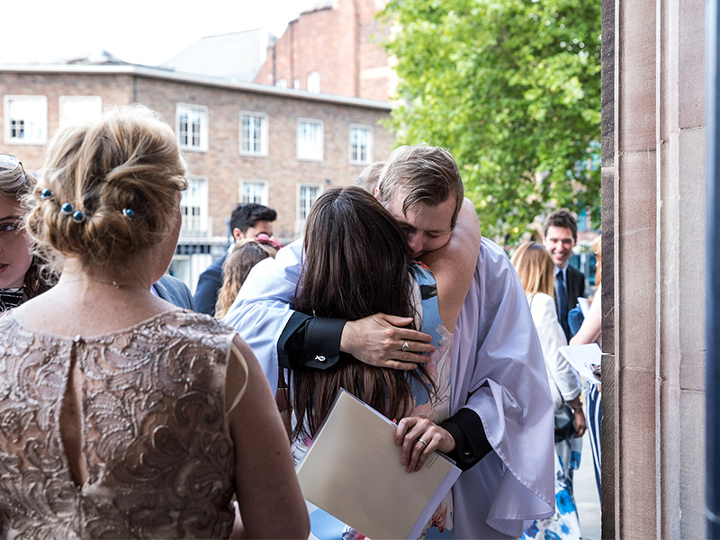 People hug after the Hereford Cathedral Deacons Ordination in July 2017, in a scene from the show “A Vicar’s Life.” Photo by Richard Weaver