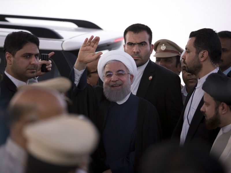 Iranian President Hassan Rouhani gestures towards media after offering Friday prayers at the Mecca Mosque in Hyderabad, India, Friday, Feb. 16, 2018. Rouhani arrived in the city Thursday beginning his three-day official visit to India. (AP Photo /Mahesh Kumar A.)