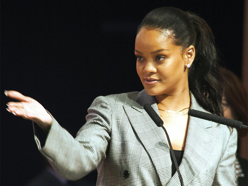 Rihanna gestures during a meeting in Dakar, Senegal, on Feb. 2, 2018. Rihanna and French President Emmanuel Macron have headlined a conference in Senegal raising hundreds of millions of dollars for education in poor countries. Cheers and whistles rang out as Rihanna was announced in the audience that included several African heads of state. (AP Photo/Mamadou Diop)