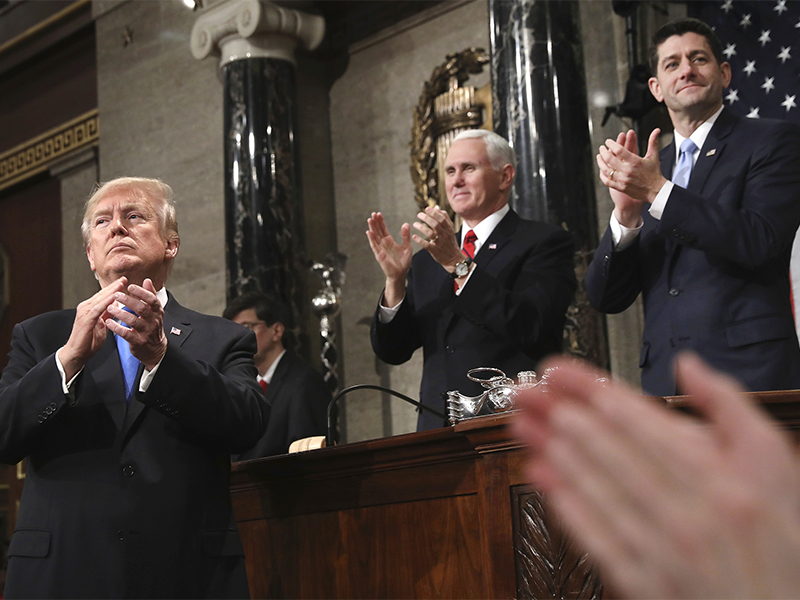 President Trump finishes his first State of the Union address in the House chamber of the U.S. Capitol to a joint session of Congress on Jan. 30, 2018,  as Vice President Mike Pence and House Speaker Paul Ryan applaud. (Win McNamee/Pool via AP; caption amended by RNS)