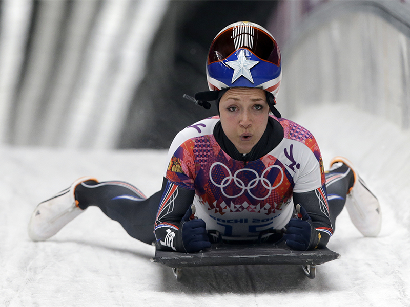 Katie Uhlaender, of the United States, brakes after her final run during the women's skeleton competition at the 2014 Winter Olympics in Krasnaya Polyana, Russia, on Feb. 14, 2014. Uhlaender finished fourth in the women's skeleton competition at the Sochi Olympics. One of the people who beat her was a Russian slider implicated in that nation's government-sponsored doping scandal. (AP Photo/Dita Alangkara, File)