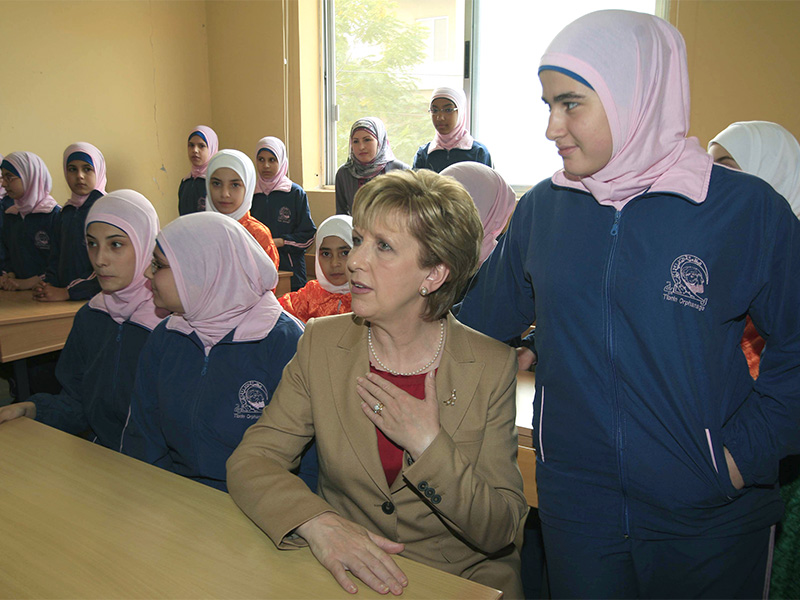 Irish President Mary McAleese, second right, sits between Lebanese orphans during her visit to an orphanage in the southern village of Tebnine, Lebanon, on Oct. 15, 2011. (AP Photo/Mohammed Zaatari)