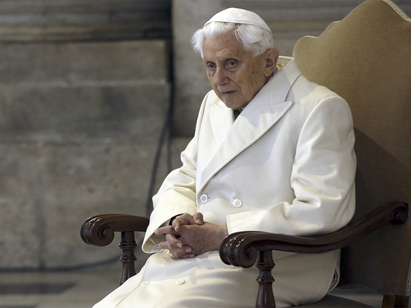Pope Emeritus Benedict XVI sits in St. Peter's Basilica as he attends the ceremony marking the start of the Holy Year on Dec. 8, 2015, at the Vatican.  (AP Photo/Gregorio Borgia)