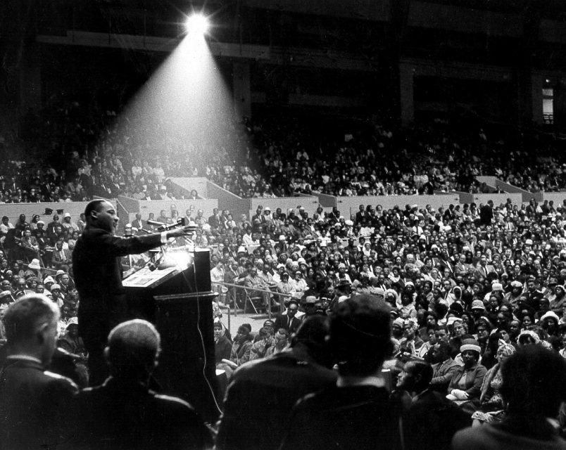 The Rev. Dr. Martin Luther King, Jr. speaks at an interfaith civil rights rally at the Cow Palace in San Francisco, on June 30, 1964. Photo by George Conklin/Creative Commons