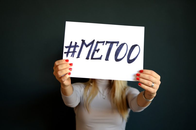 A woman holds a #MeToo sign. Photo courtesy of Creative Commons