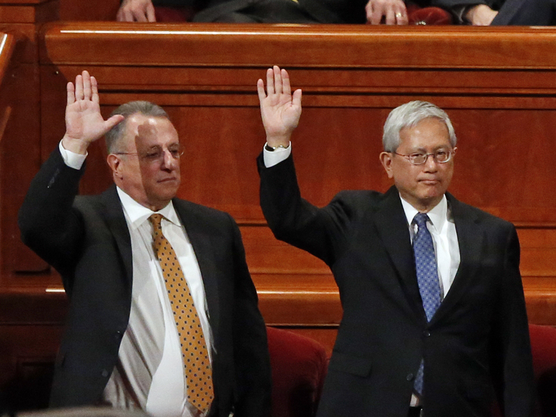 Ulisses Soares, left, of Brazil and Gerrit W. Gong, who is Chinese-American, join a panel called the Quorum of the Twelve Apostles at the start of a twice-annual conference of The Church of Jesus Christ of Latter-day Saints Saturday, March 31, 2018, in Salt Lake City. At the church conference this weekend in Salt Lake City, The Mormon church has made history and injected diversity into a top leadership panel by selecting the first-ever Latin American apostle and the first-ever apostle of Asian ancestry. (AP Photo/Rick Bowmer)