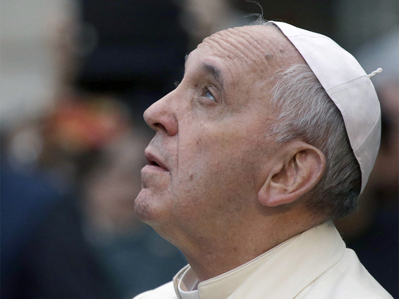 Pope Francis looks up at a statue of the Virgin Mary on the occasion of the Immaculate Conception feast in Rome, on Dec. 8, 2013. (AP Photo/Gregorio Borgia)