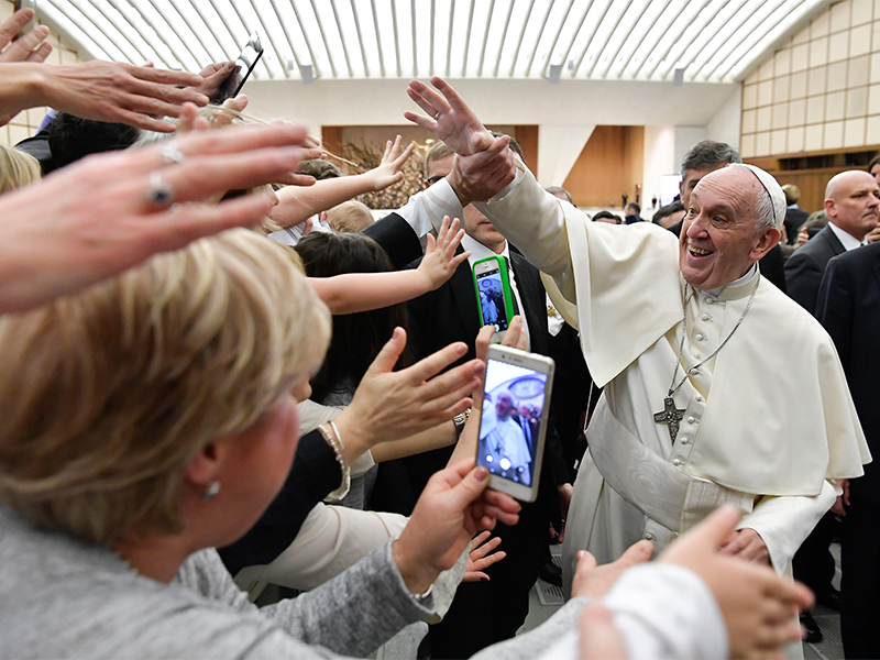 Pope Francis is cheered by faithful during an audience with health workers, in the Paul VI Hall at the Vatican, on March 3, 2018. (L'Osservatore Romano/ANSA via AP)
