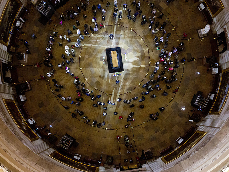 Visitors pay their respects as the casket of Billy Graham lies in honor at the the U.S. Capitol Rotunda in Washington on Feb. 28, 2018. It's a rare honor for a private citizen to lie in honor at the Capitol. (AP Photo/Jose Luis Magana)