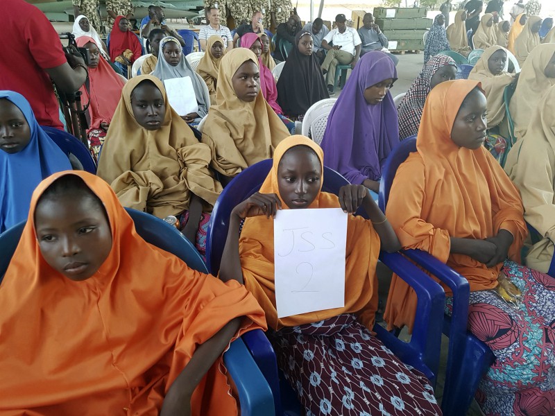 Freed schoolgirls from the Government Girls Science and Technical College Dapchi are photographed  during a handover to government officials in Maiduguri, Nigeria, on March 21, 2018. Witnesses say Boko Haram militants have returned an unknown number of the 110 girls who were abducted from their Nigeria school a month ago. (AP Photo/Hamza Suleiman)