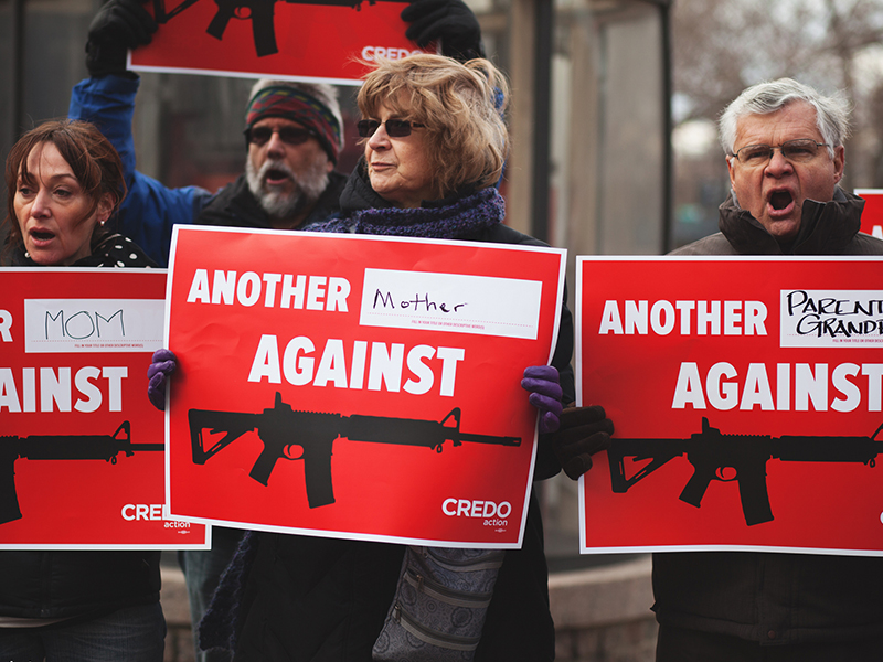 People protest the National Rifle Association’s influence in national gun control policies.  Photo by Josh Lopez/Creative Commons