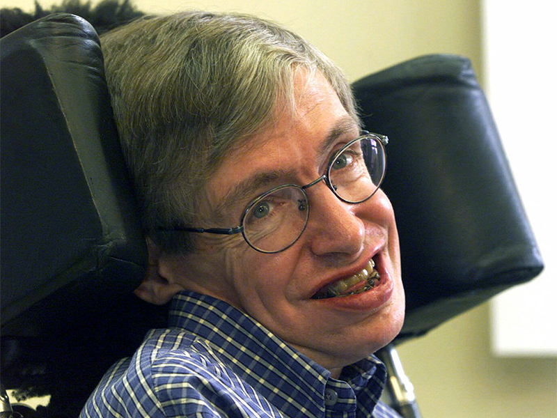 Professor Stephen Hawking smiles during a news conference at the University of Potsdam, near Berlin, Germany, on July 21, 1999. Hawking, whose brilliant mind ranged across time and space though his body was paralyzed by disease, has died, a family spokesman said early Wednesday, March 14, 2018.(AP Photo/Markus Schreiber)