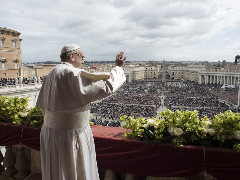 Pope Francis delivers the Urbi et Orbi (to the city and to the world) blessing at the end of the Easter Sunday Mass in St. Peter's Square at the Vatican, Sunday, April 1, 2018. (Vatican Media via AP)