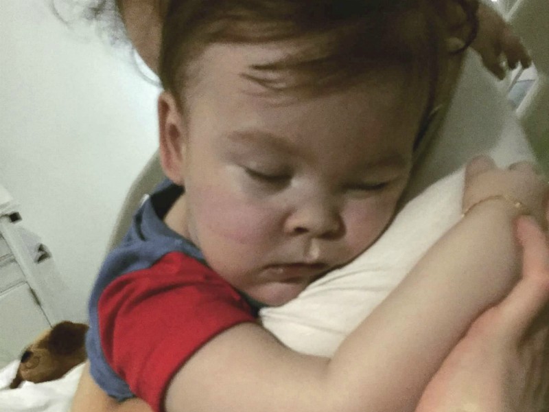 In this April 23, 2018 handout photo provided by Alfies Army Official, brain-damaged toddler Alfie Evans cuddles his mother Kate James at Alder Hey Hospital, Liverpool, England. The father of a terminally ill British toddler said the child is surviving after being taken off life support, surprising doctors who had argued he should be allowed to die. Tom Evans said his 23-month-old son, Alfie, survived for six hours with no assistance, and that doctors are now providing oxygen and hydration. (Alfies Army Official via AP)
**PERMISSION EXPIRED. DO NOT USE AGAIN.**