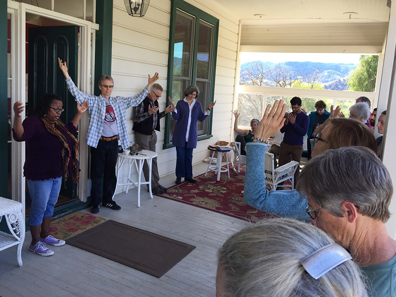 Venice Williams, left, leads Christian, Jewish and Muslim farmers in prayer at the FaithLands gathering on March 8, 2018, in Paicines, Calif. Williams is the founder of Alice’s Garden in Milwaukee, where she presides over a house church that grew out of the garden and its community. RNS photo by Kimberly Winston