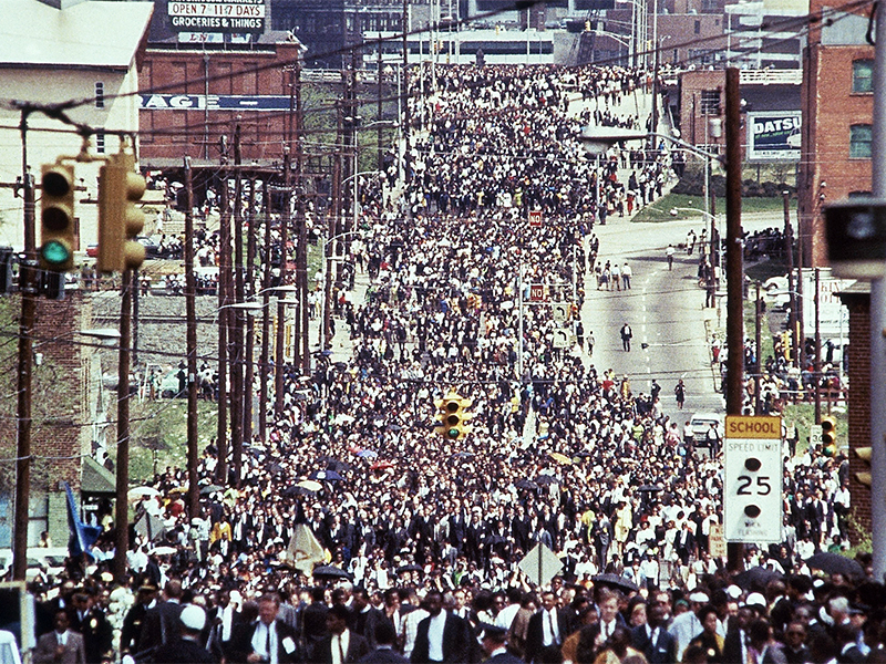 The funeral procession of the Rev. Martin Luther King Jr. arrives at Ebenezer Baptist Church in Atlanta on April 9, 1968. (AP Photo/Charles Tasnadi)