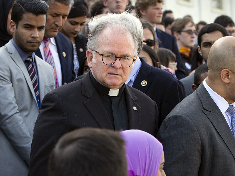 The Rev. Patrick Conroy, former chaplain of the House of Representatives, delivers an interfaith message on the steps of the Capitol in Washington for the victims of the mass shooting at an LGBT nightclub in Orlando on  June 13, 2016.  Conroy, a Roman Catholic priest from the Jesuit order, has been forced out after seven years by House Speaker Paul Ryan after complaints by some lawmakers claimed he was too political. (AP Photo/J. Scott Applewhite)