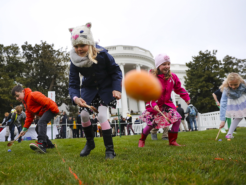 Julia Stimson, 8, from Alexandria, Va., and other children participate in the annual White House Easter Egg Roll on the South Lawn of the White House in Washington on April 2, 2018. (AP Photo/Pablo Martinez Monsivais)