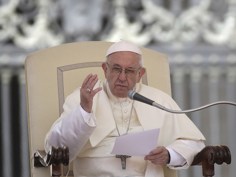 Pope Francis reads his message during his weekly general audience in St. Peter's Square at the Vatican on May 16, 2018. Francis warned Wednesday that the latest spasm of violence in the Holy Land is only hurting chances for peace, and he called for revived efforts at dialogue and justice. (AP Photo/Alessandra Tarantino)
