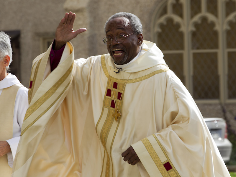 Episcopal Church Presiding Bishop-elect Michael Curry waves to the crowd as he arrives at the Washington National Cathedral on Nov. 1, 2015, in Washington.  (AP Photo/Jose Luis Magana)