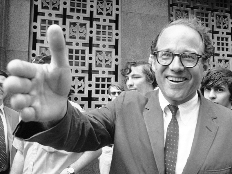William Sloane Coffin Jr., Yale University Chaplin, reaches out to shake hands with supporters as he enters Federal Court in Boston, July 10, 1968 for sentencing in an antidraft conspiracy. Coffin, along with Dr. Benjamin Spock and two others, were convicted of conspiring to aid, abet and counsel young men to evade the draft. (AP Photo)