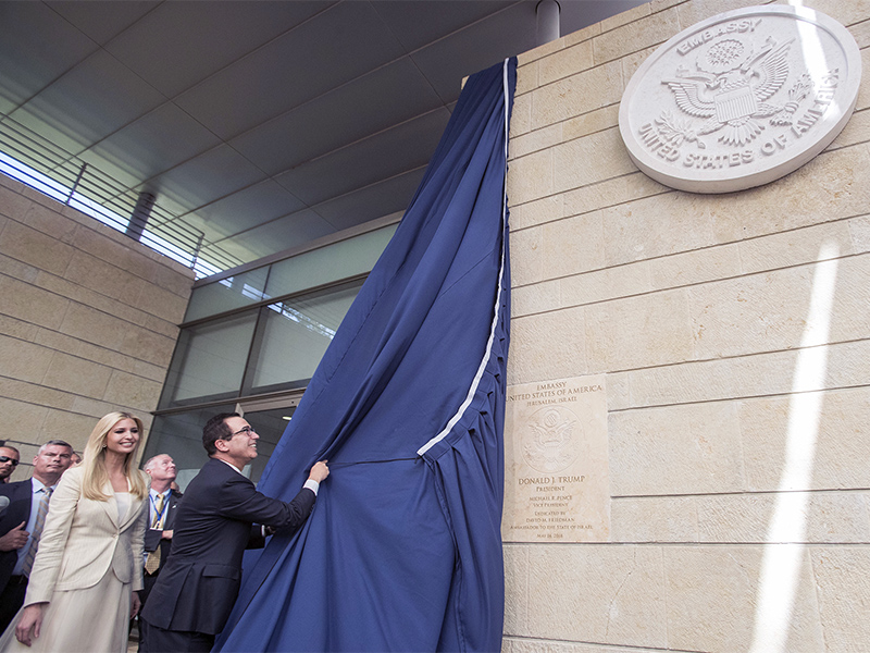 U.S. President Trump's daughter Ivanka, left, and U.S. Treasury Secretary Steve Mnuchin unveil a plaque during the opening ceremony of the new US embassy in Jerusalem, on May 14, 2018. Amid deadly clashes along the Israeli-Palestinian border, President Trump's top aides and supporters on Monday celebrated the opening of the new U.S. Embassy in Jerusalem as a campaign promise fulfilled. (Flash90 Photo/Yonatan Sindel via AP)