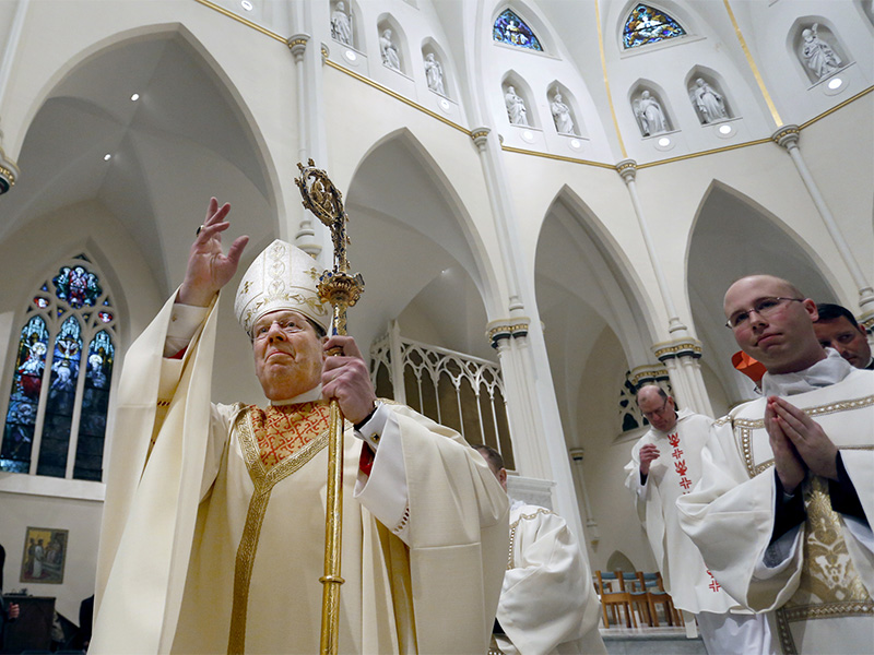 The Most Rev. Robert Peter Deeley blesses the congregation during the closing procession after he was installed as the 12th Bishop of Portland at the Cathedral of the Immaculate Conception in Portland, Maine, on Feb., 14, 2014. (AP Photo/Portland Press Herald, Gabe Souza, Pool)